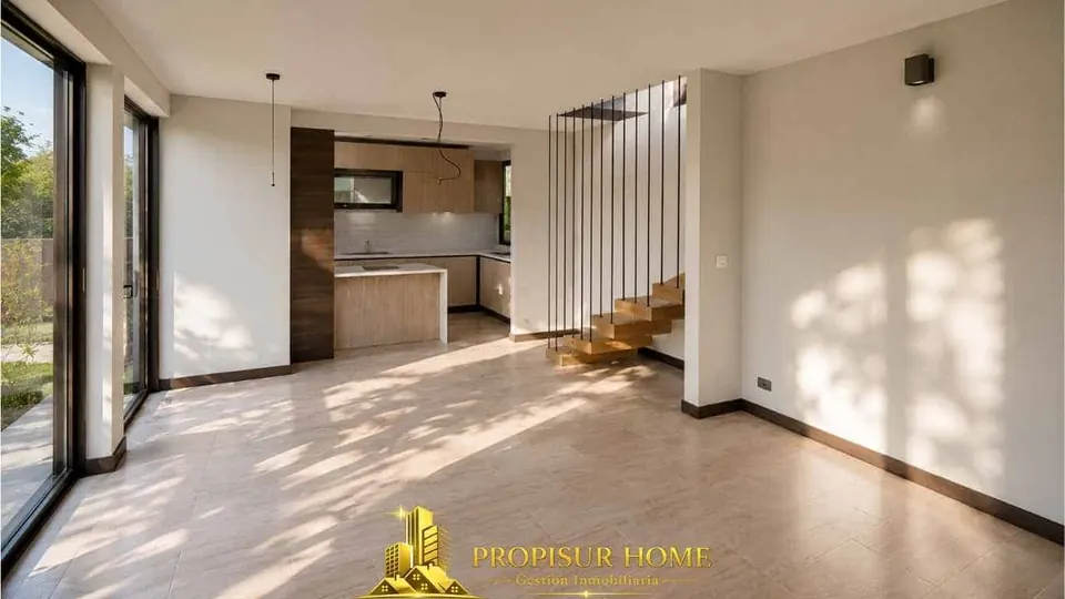 Living comedor de casa nueva en venta en Angol con cocina integrada, escalera de diseño y amplios espacios
